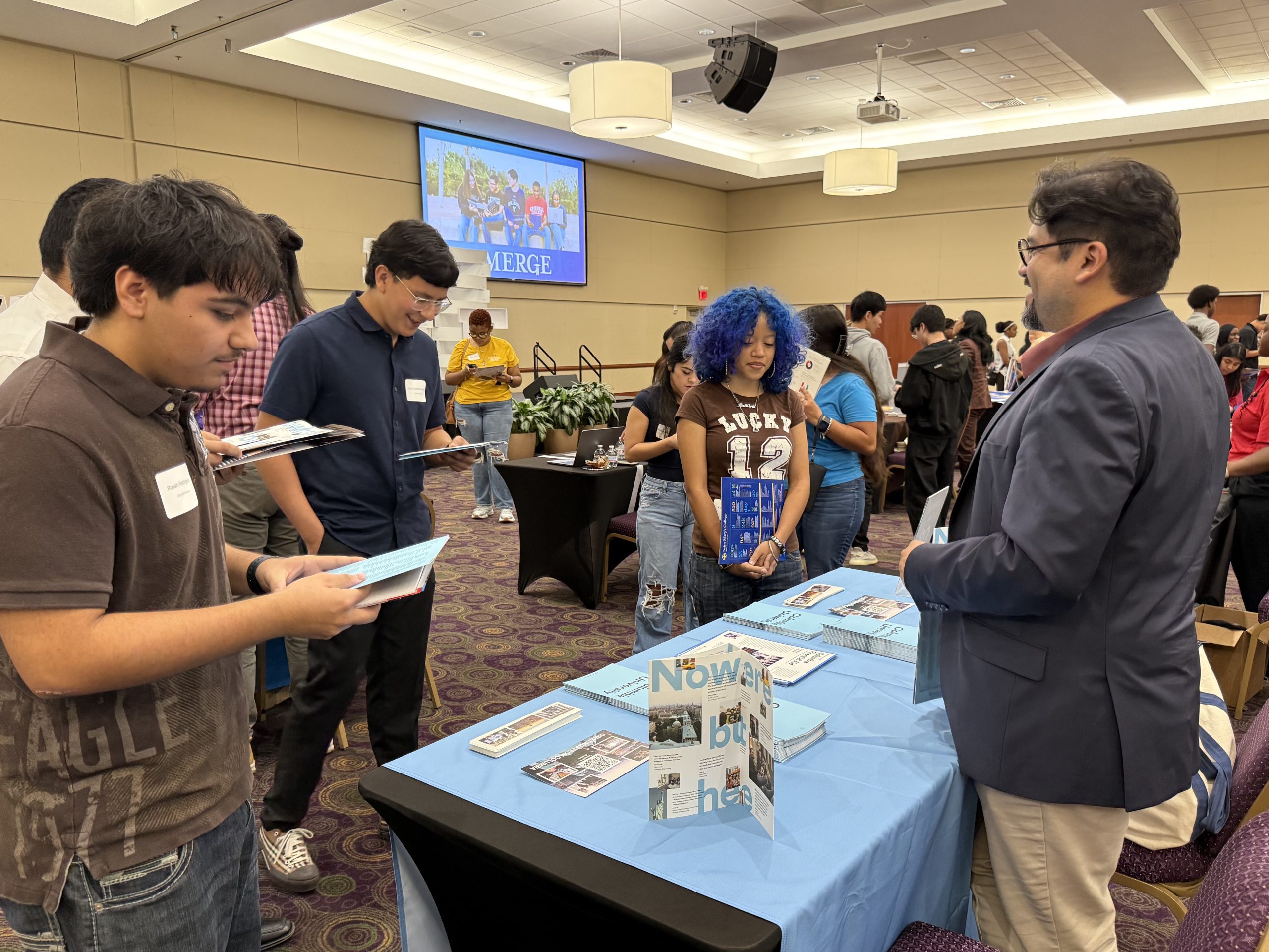 EMERGE scholars at a college booth at the 2025 Top Tier College Fair